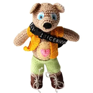 Crochet teddy bear tourist with clothes. Small cute teddy dress up